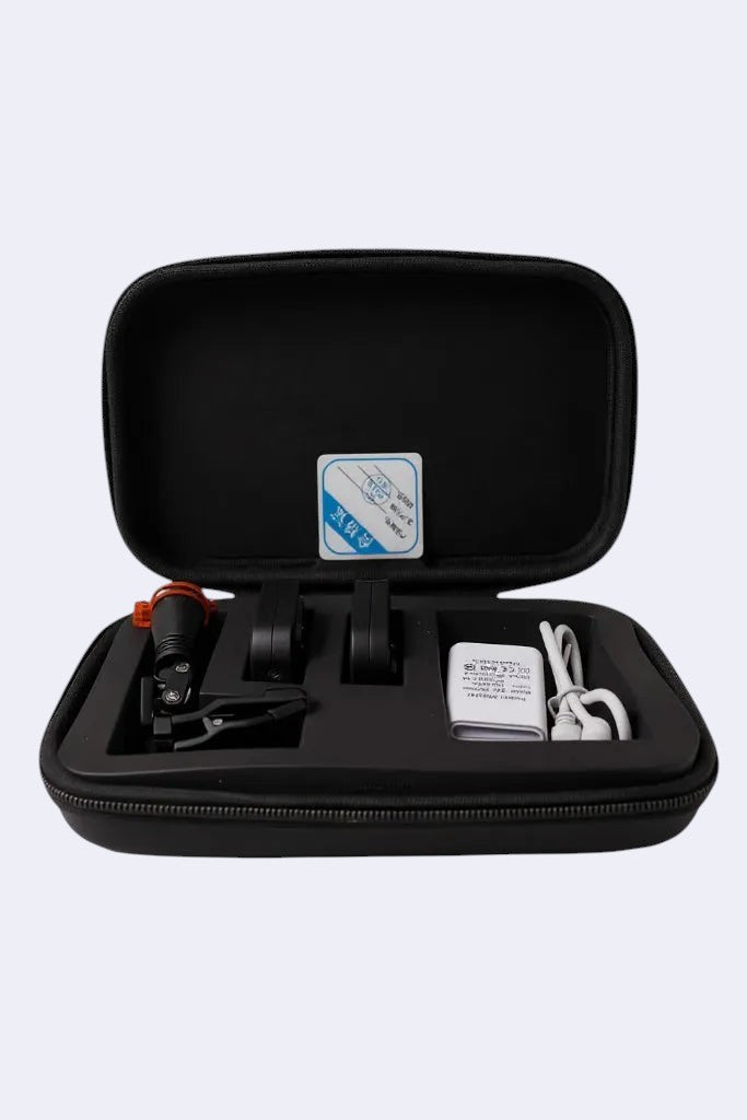 DENTISTOOLBOX rechargeable headlamp with removable battery, charger, and spare battery in a black case.