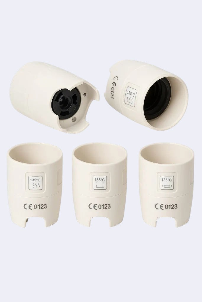DENTISTOOLBOX white plastic ultrasonic insert wrench tool, CE 0123 certified for 135°C autoclave sterilization.